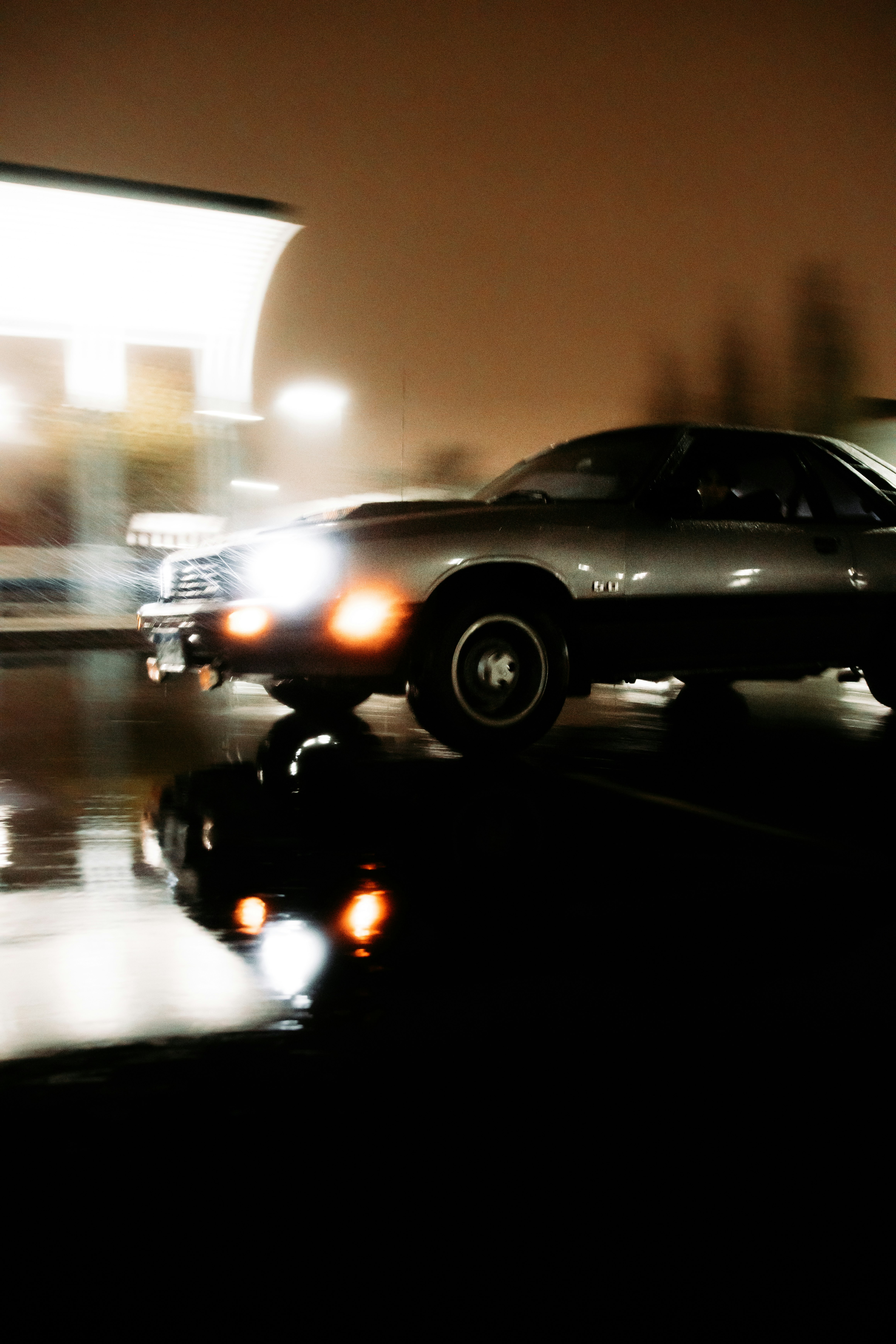 black sedan on road during night time